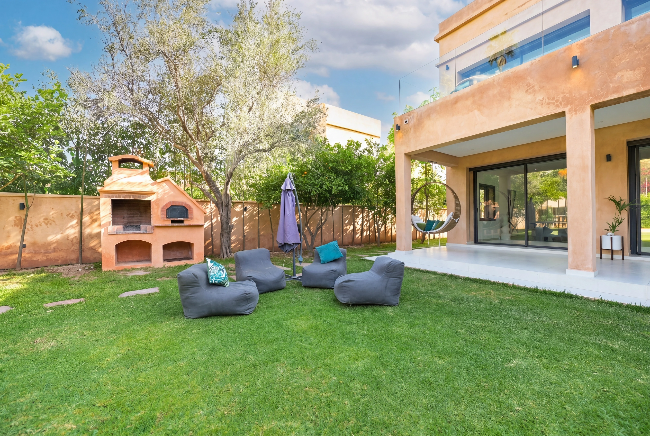 Villa Adam — Garden BBQ and pizza oven with beanbag lounge area
