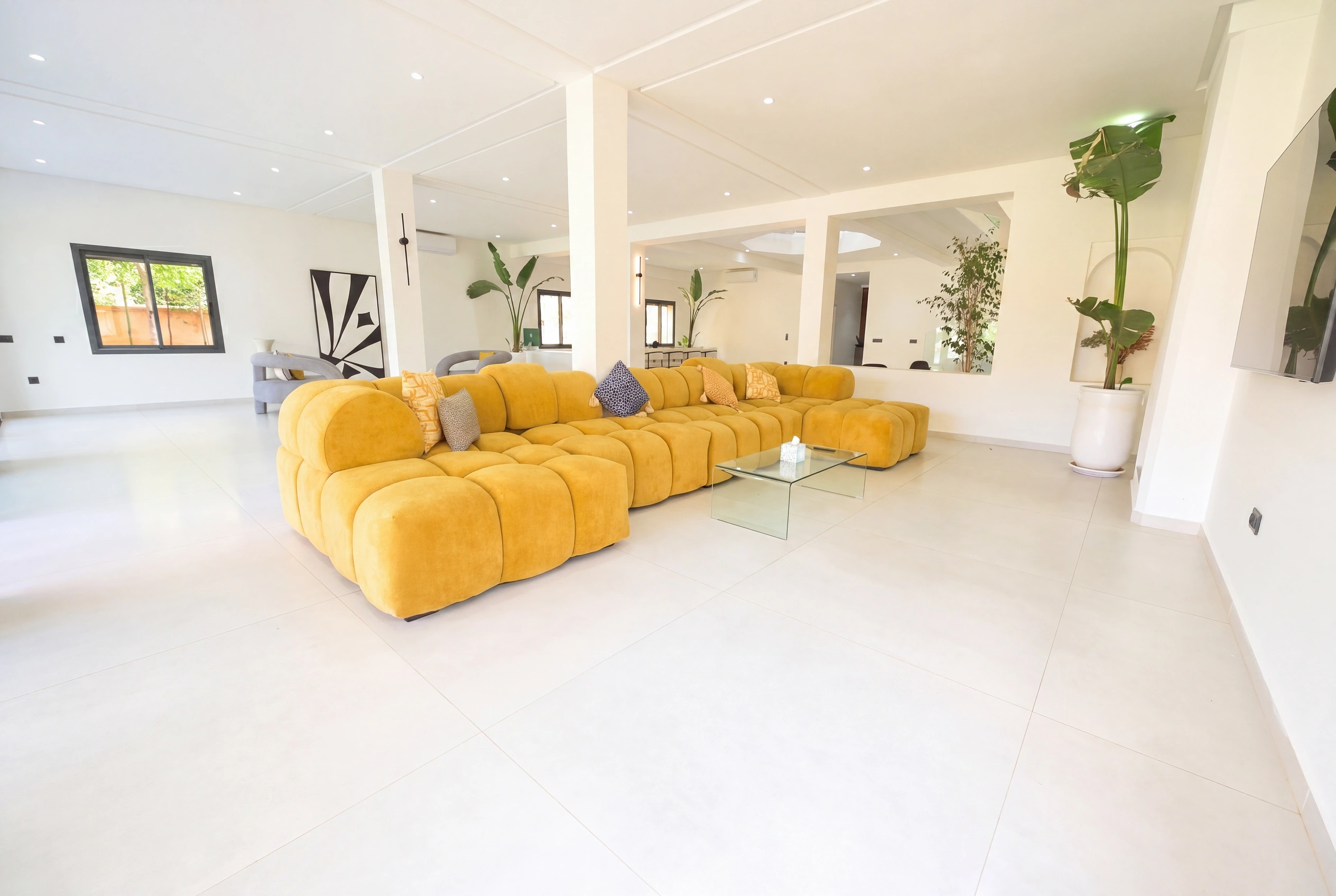 Villa Adam — Spacious living room with signature yellow sectional sofa